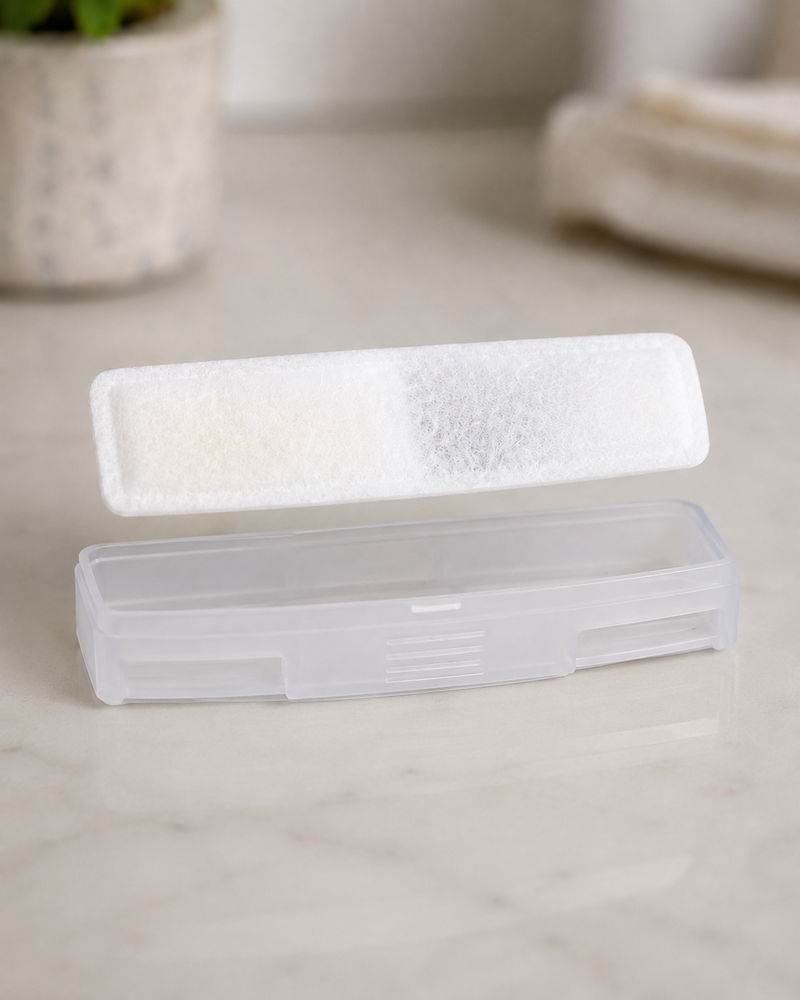 The multi-layer FlowMate Pro filter lifted out of its clear holder